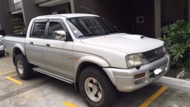 White Mitsubishi Strada 2001 for sale in Quezon City