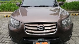 Brown Hyundai Santa Fe 2010 for sale in Quezon City 
