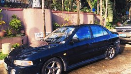 Selling Blue Mitsubishi Lancer 1999 in Quezon City 