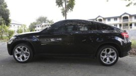 Selling Black Bmw X6 2011 Automatic Gasoline at 52000 km 