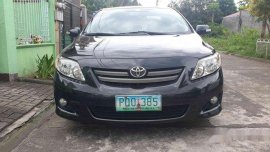 Black Toyota Corolla Altis 2010 at 160000 km for sale 