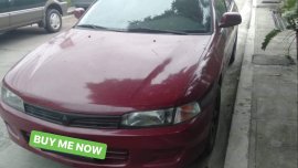 Selling Red Mitsubishi Lancer 1997 at 100000 km 