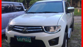 Selling 2nd Hand Mitsubishi Strada 2013 Automatic Diesel 
