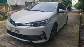 Selling White Toyota Corolla Altis 2018 Automatic Gasoline at 7000 km 
