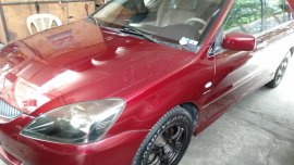 Red 2004 Mitsubishi Lancer for sale in Quezon City 