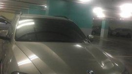 Selling Silver Bmw X5 2010 at 57000 km 