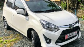 Selling White Toyota Wigo 2019 Hatchback at 5000 km 