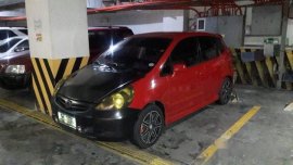 Red Honda Fit 2008 at 95000 km for sale