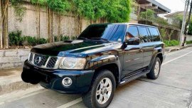 Selling Black Nissan Patrol 2009 at 58000 km 
