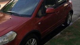 Orange Suzuki Sx4 2014 at 65000 km for sale in Manila