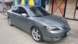 Selling Grey Mazda 323 2006 at 65000 km 