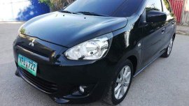 Selling Black Mitsubishi Mirage 2014 at 26000 km