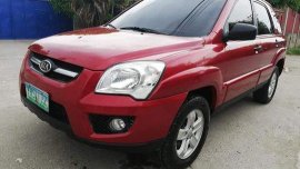 Red Kia Sportage 2010 for sale in Talisay