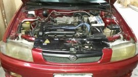Selling Red Mazda 323 1999 Manual Gasoline in General Salipada K. Pendatun