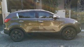 Selling Brown Kia Sportage 2012 Automatic Gasoline at 68000 km 