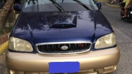 Blue Kia Carnival 2001 at good price in Cavite