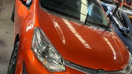 Selling Orange Toyota Wigo 2019 in Quezon City