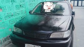 Black Toyota Corolla 1999 for sale in Manual
