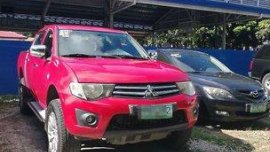 Red Mitsubishi Strada 2011 at 67000 km for sale 