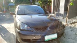 Sell Grey 2009 Mitsubishi Lancer in Quezon City