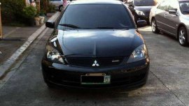 Sell Black 2009 Mitsubishi Lancer in Quezon City