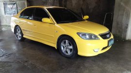 Yellow Honda Civic 2004 for sale in Sta. Rosa-Nuvali Rd.