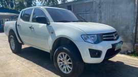 Sell White Mitsubishi Strada in Lipa