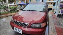 Selling Red Honda Odyssey in Rodriguez