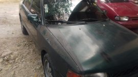 Sell Black Mazda 323 for sale in Valenzuela