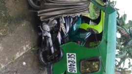 Selling Green Kia Carens in Tubod