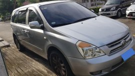 Selling Silver Kia Carnival 2010 Van in Manila