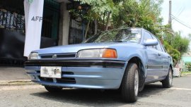 Selling Blue Mazda 323 in Las Piñas