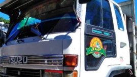 White Isuzu Elf for sale in La Trinidad