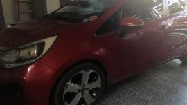 Selling Red Kia Rio in Angeles