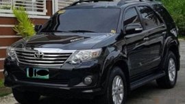 Black Toyota Fortuner 2013 SUV Automatic for sale in Manila
