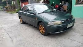 Green Mazda 323 for sale in Bulacan