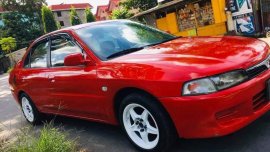 Red Mitsubishi Lancer for sale in Quezon City