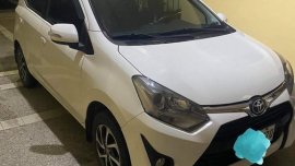 Pearl White Toyota Wigo for sale in Quezon 