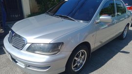 Sell Pearl White Mitsubishi Lancer in Quezon City