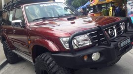 Nissan Patrol 2005 ( maroon )