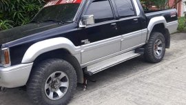 Selling Black Mitsubishi Strada 1995 in Davao