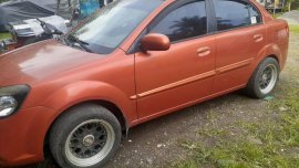 Orange Kia Rio 2015 for sale in San Pablo City