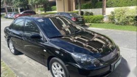 Black Mitsubishi Lancer 2011 for sale in Quezon
