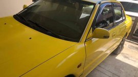 Yellow Mitsubishi Lancer 1994 for sale in Pateros