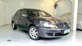 Selling Greyblack Mitsubishi Lancer 2011 in Quezon City