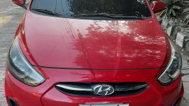Red Hyundai Accent hatchback 2016