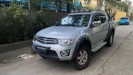 Brightsilver Mitsubishi Strada 2013 for sale in Quezon