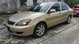 Selling Golden Mitsubishi Lancer 2010 in Imus