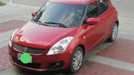 Red Suzuki Swift 2013 for sale in Lupao