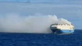 Cargo ship loaded with over 1,000 Porsches catches fire  